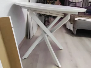 Handyman assembling folding table in holiday-decorated Toronto living room