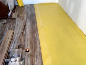 Laminate flooring installation in progress with underlayment and Classen Expert 4V planks in Toronto home